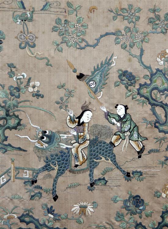 A Chinese embroidered silk picture of children with a qilin, late 19th century, panel 51 x 38cm, framed and glazed